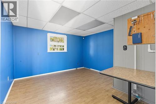 Unfurnished office with a drop ceiling and light wood-style flooring - 1036 Upper Wentworth Street, Hamilton, ON 