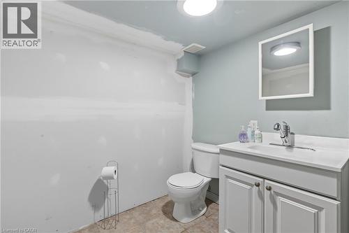 Bathroom featuring vanity and light tile patterned floors - 1036 Upper Wentworth Street, Hamilton, ON 
