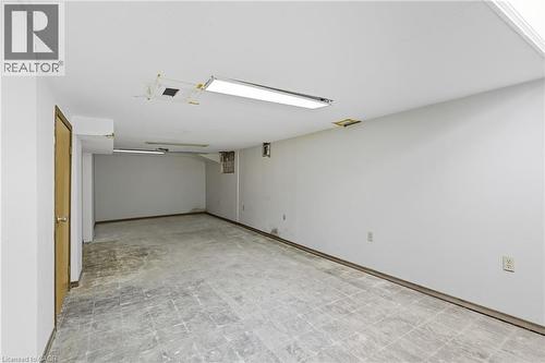 Finished below grade area with tile patterned floors and baseboards - 1036 Upper Wentworth Street, Hamilton, ON 
