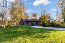 Rear view of property with a yard and a patio area - 