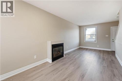 187 Barton Street W, Hamilton, ON - Indoor Photo Showing Living Room With Fireplace