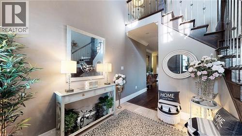 Entrance foyer with stairway, a high ceiling, and wood finished floors - 537 Millstream Drive, Waterloo, ON - Indoor Photo Showing Other Room