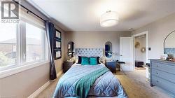 Bedroom featuring carpet and baseboards - 