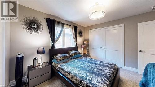 Bedroom with light carpet and a closet - 537 Millstream Drive, Waterloo, ON - Indoor Photo Showing Bedroom