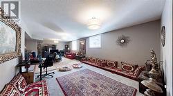 Carpeted office with a textured ceiling - 