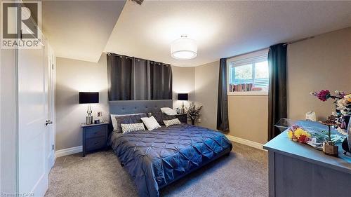 Bedroom featuring carpet flooring and a textured ceiling - 537 Millstream Drive, Waterloo, ON - Indoor Photo Showing Bedroom