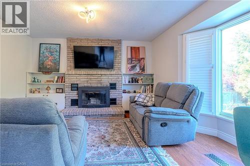 14 Windstar Place Unit# Upper, Hamilton, ON - Indoor Photo Showing Living Room With Fireplace