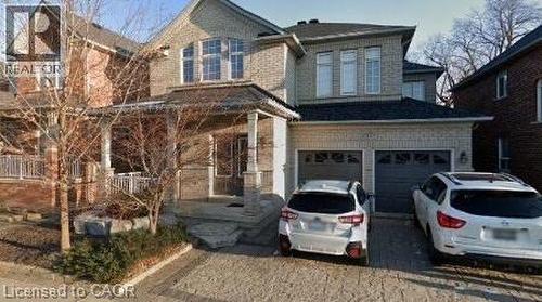 View of front of home featuring a garage and driveway - 2429 Whitehorn Drive, Burlington, ON - Outdoor