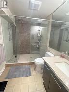 Bathroom featuring vanity, tile patterned flooring, and a stall shower - 