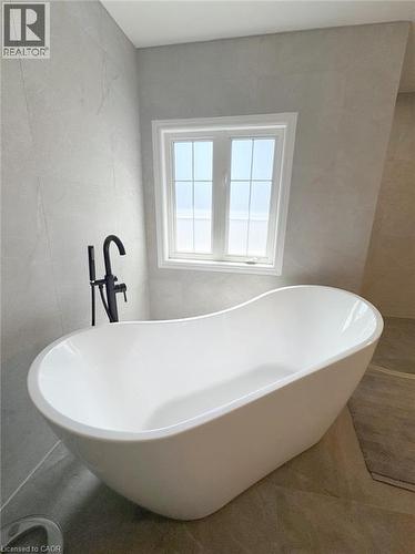 Full bathroom with a freestanding tub and tile walls - 2429 Whitehorn Drive, Burlington, ON - Indoor Photo Showing Bathroom