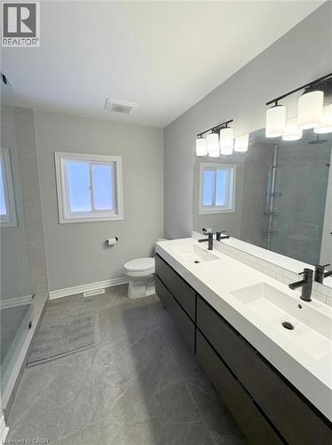 Full bathroom featuring walk in shower, double vanity, and plenty of natural light - 2429 Whitehorn Drive, Burlington, ON - Indoor Photo Showing Bathroom
