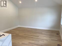 Spare room featuring light wood-type flooring and recessed lighting - 