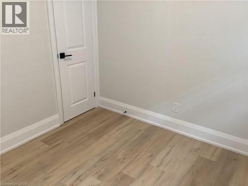 Detailed view of wood finished floors and baseboards - 229 West 18Th Street, Hamilton, ON - Indoor Photo Showing Other Room