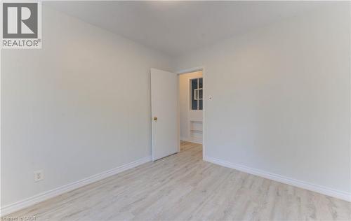 Empty room featuring light wood finished floors and baseboards - 50 Gordon Avenue, Kitchener, ON - Indoor Photo Showing Other Room