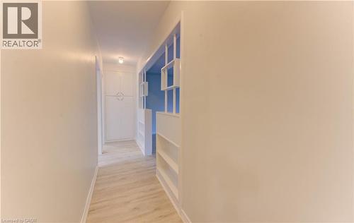 Hall with light wood-style flooring and baseboards - 50 Gordon Avenue, Kitchener, ON - Indoor Photo Showing Other Room