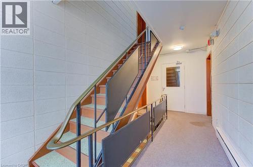 Staircase with a baseboard radiator and carpet - 50 Gordon Avenue, Kitchener, ON - Indoor Photo Showing Other Room
