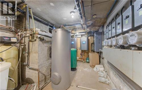 Utility room featuring water heater and electric panel - 50 Gordon Avenue, Kitchener, ON - Indoor Photo Showing Basement