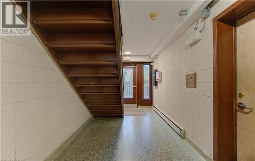 Hallway featuring baseboard heating and speckled floor - 50 Gordon Avenue, Kitchener, ON - Indoor Photo Showing Other Room