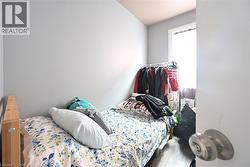 Bedroom featuring wood finished floors - 