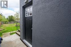 Exterior view of stucco siding and fence - 