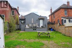 Rear view of house with stucco siding - 