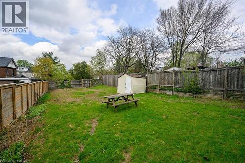 View of yard featuring a storage unit and an outbuilding - 129 Dundurn Street N, Hamilton, ON - Outdoor With Backyard