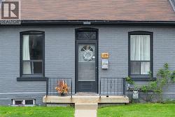 Doorway to property featuring brick siding - 