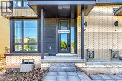 Property entrance with brick siding - 