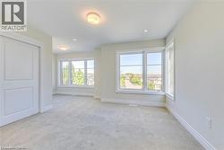 Unfurnished room with light carpet and recessed lighting - 