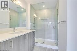 Full bath featuring vanity and a shower stall - 