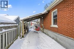 View of snow covered exterior with brick siding - 