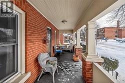 Snow covered patio with a porch - 