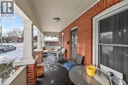 Snow covered patio with a porch - 