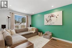 Living area featuring wood finished floors and recessed lighting - 