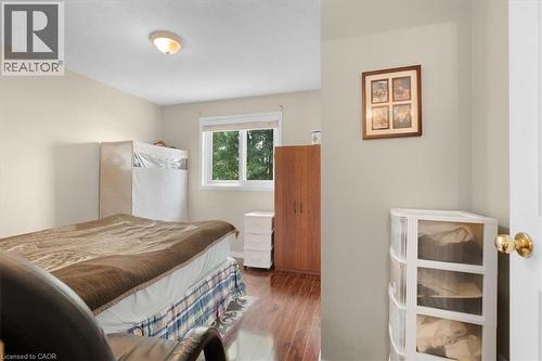 Bedroom featuring wood-type flooring - 75 Marisa Street, Kitchener, ON - Indoor Photo Showing Bedroom