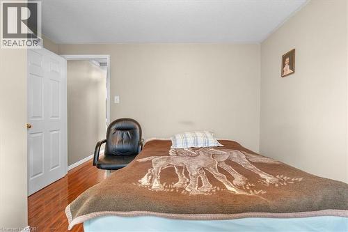 Bedroom with dark wood finished floors and a textured ceiling - 75 Marisa Street, Kitchener, ON - Indoor Photo Showing Bedroom