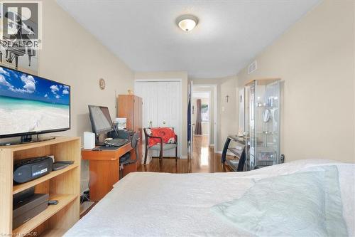 Bedroom with a closet and wood finished floors - 75 Marisa Street, Kitchener, ON - Indoor Photo Showing Bedroom