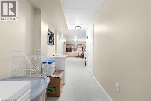 Hallway with light colored carpet and baseboards - 75 Marisa Street, Kitchener, ON - Indoor Photo Showing Bathroom