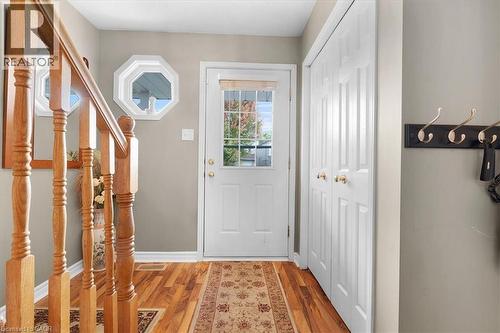 Doorway to outside featuring wood finished floors and baseboards - 75 Marisa Street, Kitchener, ON - Indoor Photo Showing Other Room