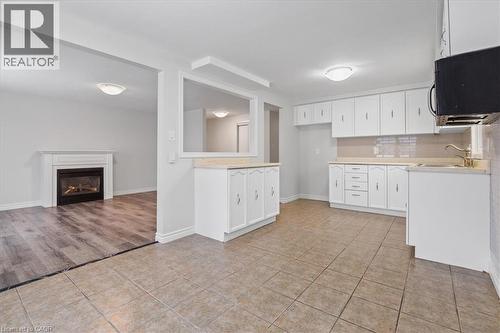67 Old Carriage Drive, Kitchener, ON - Indoor Photo Showing Kitchen With Fireplace