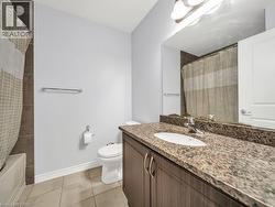 Bathroom with vanity, light tile patterned flooring, and shower / bath combo with shower curtain - 