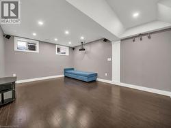 Unfurnished room featuring recessed lighting, dark wood-style floors, and plenty of natural light - 