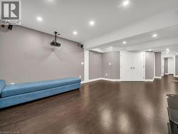 Unfurnished room featuring recessed lighting and dark wood finished floors - 
