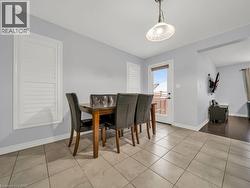 Dining room with baseboards and tile patterned flooring - 