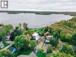 Aerial view of property and surrounding area featuring a large body of water - 