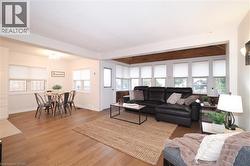 Living area featuring wood finished floors and baseboards - 