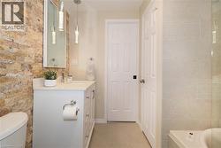 Full bathroom featuring vanity and a tub to relax in - 