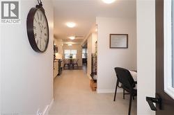 Corridor featuring baseboards and attic access - 