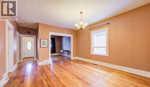 Entryway with a chandelier and hardwood / wood-style flooring - 14 Grandview Street, Brantford, ON - Indoor Photo Showing Other Room
