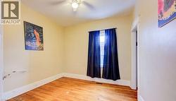 Spare room with light wood-style flooring and baseboards - 